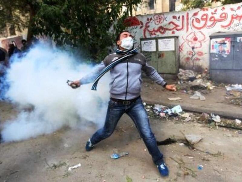 Coming up for freedom & air: The protesting people are met with harmful gases. Egyptian police under SCAF 
command have been using excessive force against anti-government crowds. 'Teargas' is being used in no short supply in 
Tahrir:  Potent gases, suspected to be nerve gas or cyanide gas, are causing hundreds of protesters to faint or worse. 