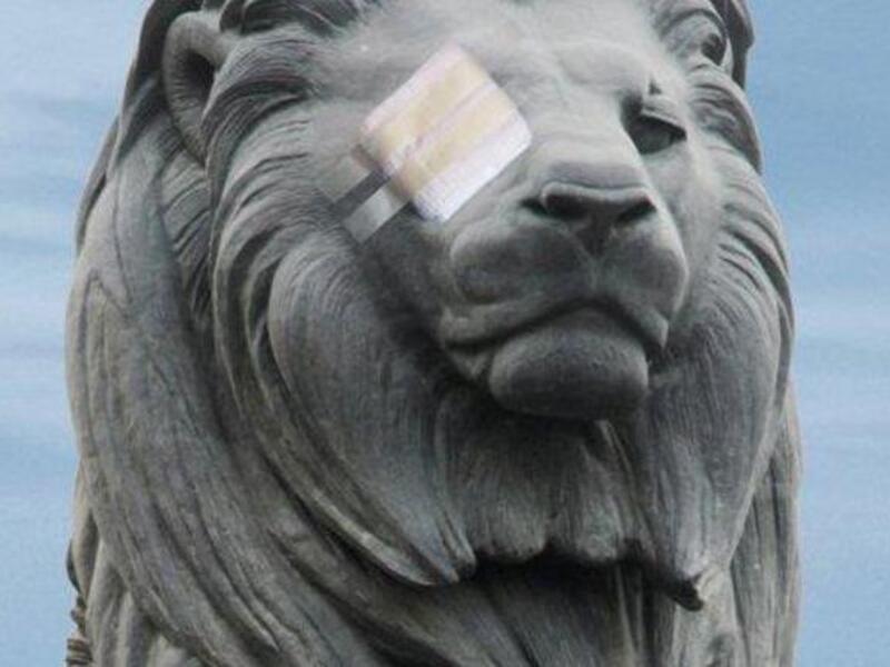 Speaking of 'Assad' (Arabic for 'lion'): An Egyptian lion has its eye bandaged to represent the striking wound pattern of the second 
Egyptian revolution. The symbolism is endless. Trying to block a people's outcry and obscure their vision for 
change. Obstructing the world media lens. An attempt to disable their efforts to be seen and heard.