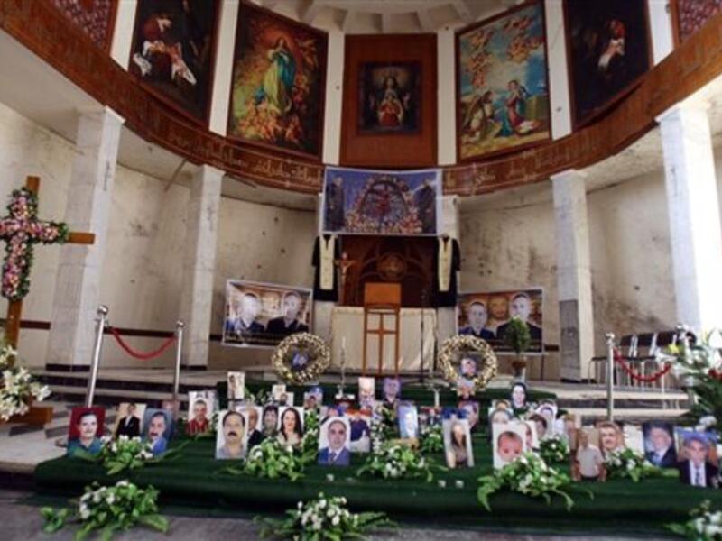 A shrine for Iraqi Christians who were killed in Al-Qaeda siege is erected at Sayidat alNejat Church in Baghdad  as Christmas for Iraqi Christian community will this year be a time of fear and cancelled celebrations instead of rejoicing following renewed threats by Al-Qaeda and the church massacre.