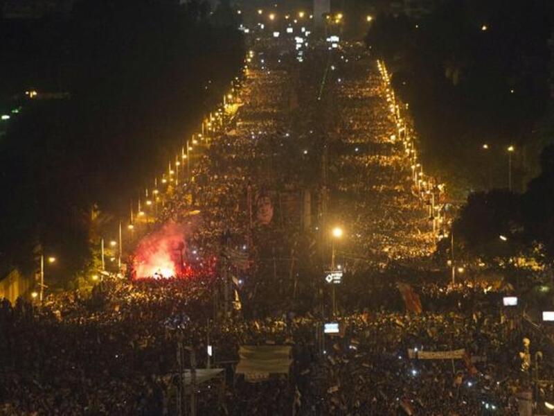 Hundreds of thousands of protesters marching in Cairo. The death toll in Egypt has now hit 14 with hundreds of others wounded, according to the Ministry of Health. (AFP Photo)