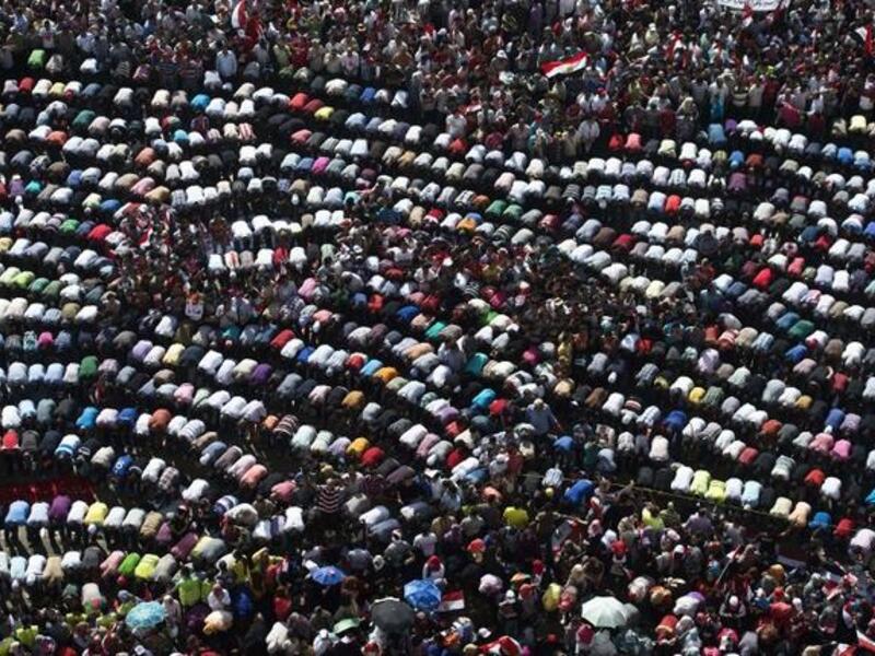 Mass mid-protest prayer session in the iconic Tahrir Square (AFP)
