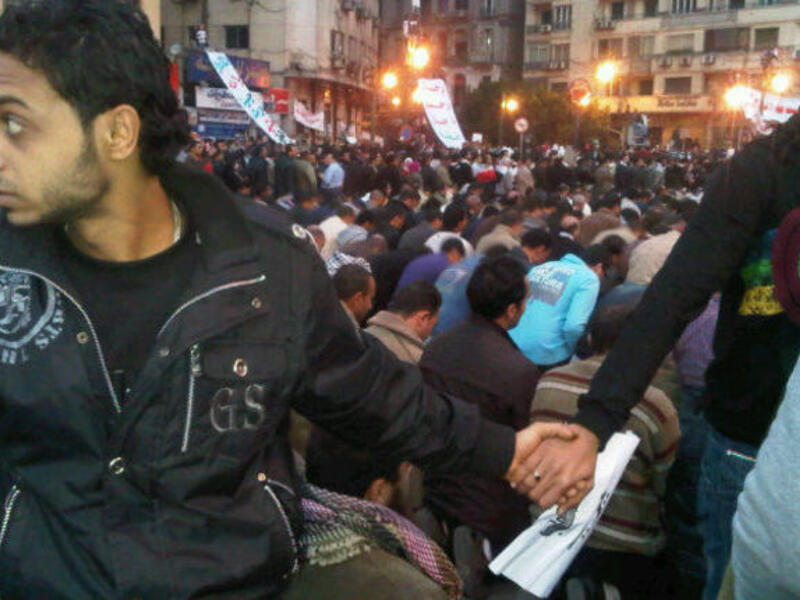 All Egyptians rally round each other: Coptic Christian Egyptians protecting the Muslim Egyptians during prayer.