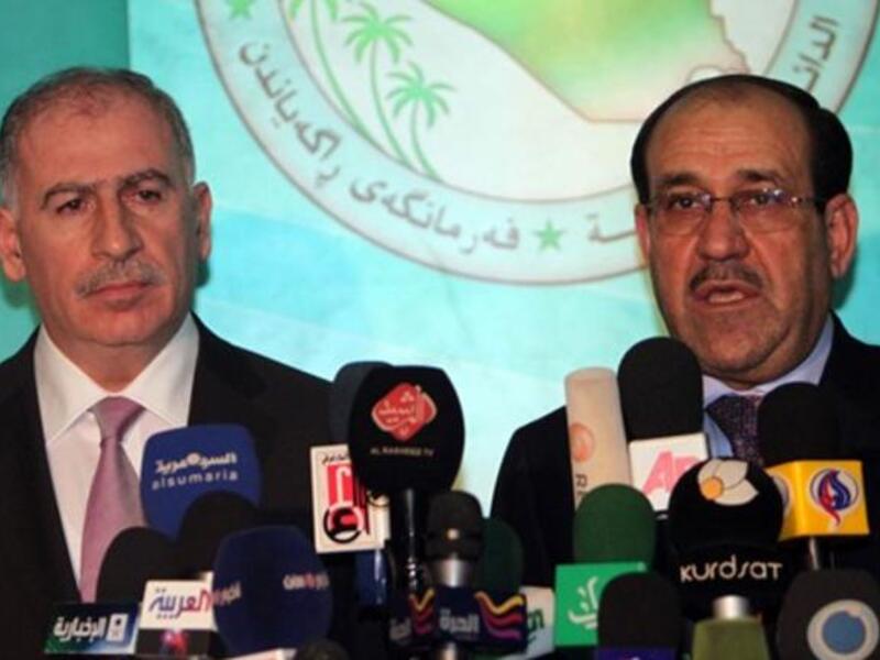 Iraqi Parliament Speaker Osama Al-Nujaifi (L) and Prime Minister Nuri al-Maliki hold a press conference in Baghdad.