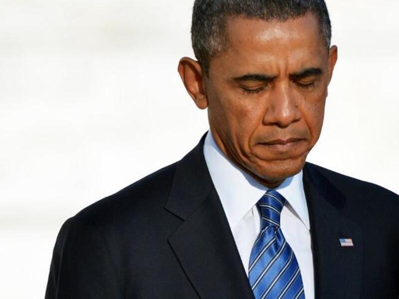 President Barack Obama feels the weight of the world