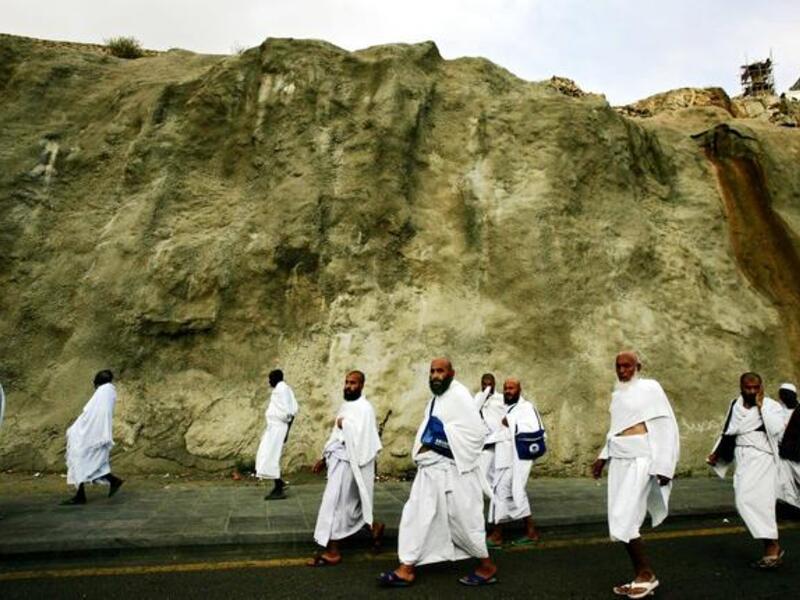 The passage or pilgrimage begins just outside Mecca, at Miqat, or entry station to the Hajj. When the pilgrim reaches
Miqat, fully washed & in correct attire (Ihram), they say 'Talbiyah'- a vow to perform Hajj. After reaching Mecca, 
one should head straight to Ka’aba ,in the vicinity of Masjid-el-Haram, and perform 'Tawaaf' (circumambulation).