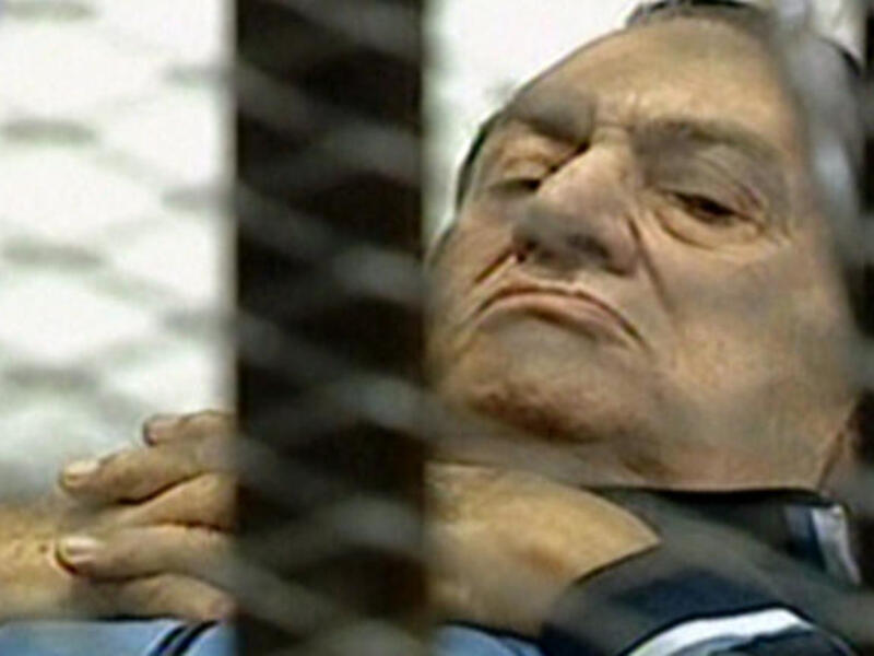 Mubarak on trial on a stretcher trolley