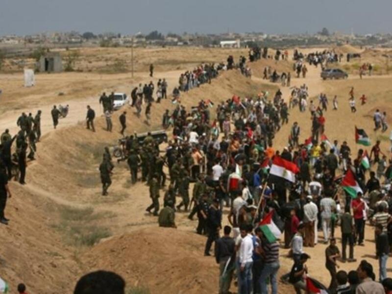 Egypt's Edge: This much infiltrated border was breached May 15, 2001 by Palestinian protestors. Palestinian Hamas security forces stand guard at Rafah border terminal between Egypt and the southern Gaza Strip during a rally to mark the 63th anniversary of the "Nakba".