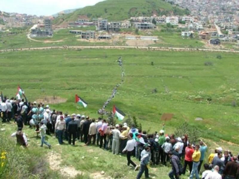 Still Syrian skirmish: a modest army of protesters walking across the fields near town of Majdal Shams in the Israeli annexed Golan Heights on May 15, 2011, as they marched towards the border. Two people killed and dozens wounded  when the Israeli army opened fire at "thousands" of protesters.