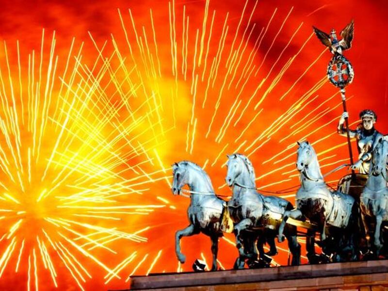 Fireworks explode over the Quadriga statue atop the Brandenburg Gate on New Year's Eve in Berlin, Germany. According to the media, up to one million people celebrate the country's biggest New Year's Eve Party.