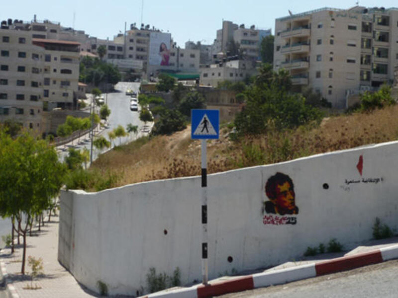 Naji el-Ali and Handala graffiti on a Ramallah wall by Palestinian street artist