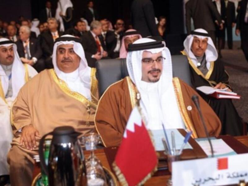 Crown Prince of Bahrain Sheikh Salman bin Hamad al-Khalifa (front) and Foreign Minister Sheikh Khalid bin Ahmed Al-Khalifa (2nd L).