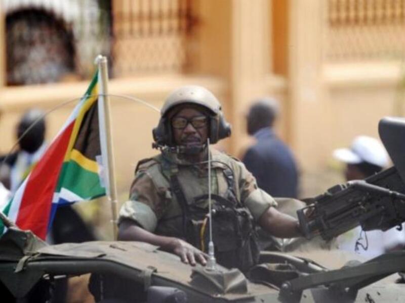 A South African soldier rides a commando truck as they follow the South Africa's President Jacob Zuma's arrival to the ceremony in the capital Juba.
