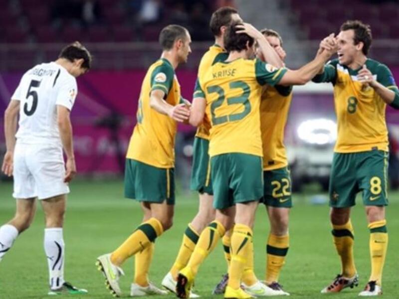 QATAR: Australia's players celebrate after midfielder Brett Emerton scored his team's fourth goal against Uzbekistan during their 2011 Asian Cup semi-final football match, January 25, 2011.