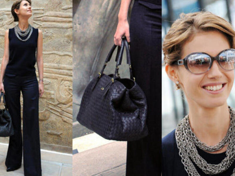 Asma Al Assad shows off her handbags.