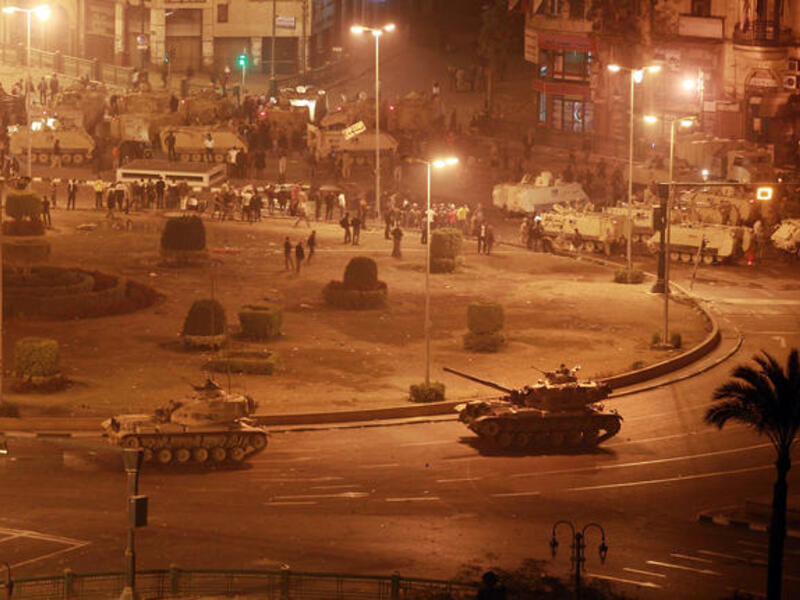 Army tanks line up in Tahrir Square.