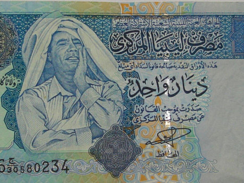 Proud enough to stamp his clownish image on his national exchange. The Qaddafi bill of choice!