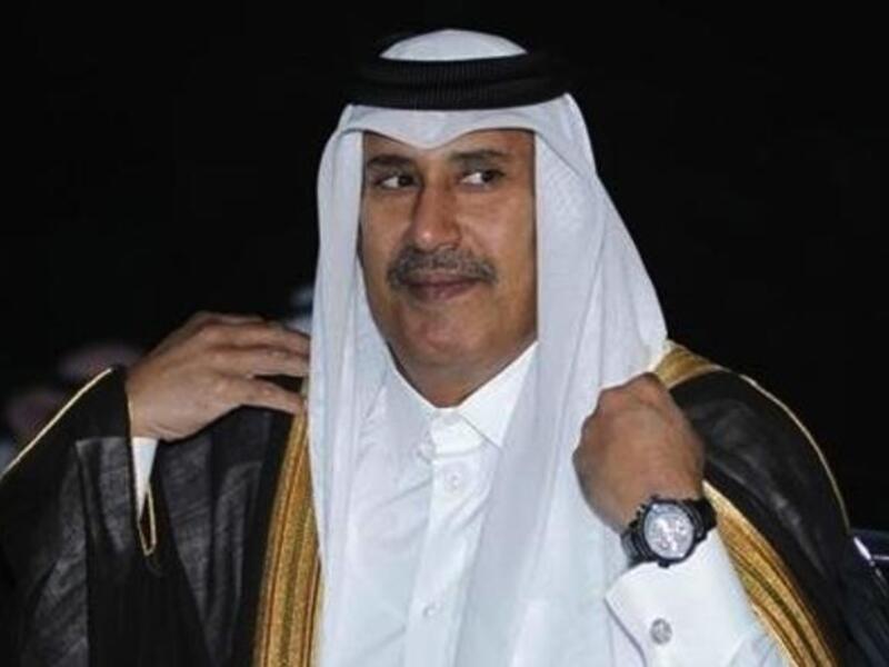 Qatari Prime Minister Sheikh Jassim bin Jaber Al Thani cozies up to the women