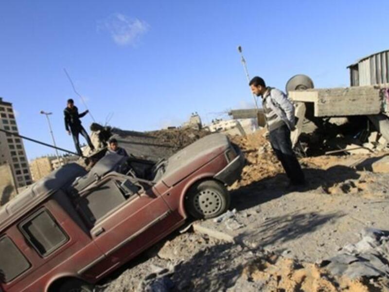 Palestinians inspect a destroyed Hamas compound after an Israeli strike overnight in Gaza City as Israel staged air raids in Gaza overnight, wounding 17 people.