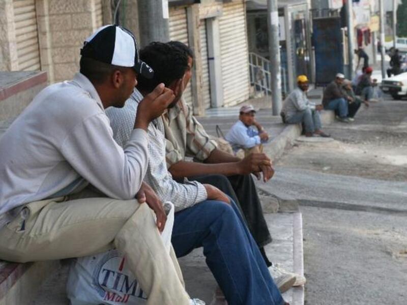 Migrant Egyptian workers line the streets in Morsi's time, promised to deliver employment