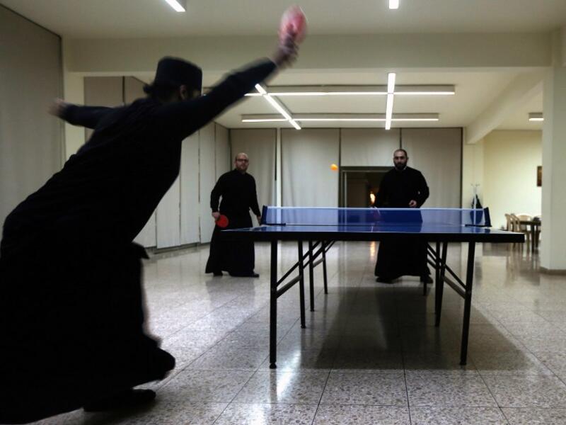 Greek Orthodox priests play tennis table during a break from their studies at the St. John of Damascus Institute of Theology in Balamand in northern Lebanon on March 2, 2016. The institute was established in 1832 and hosts students from all over the world.

PATRICK BAZ / AFP