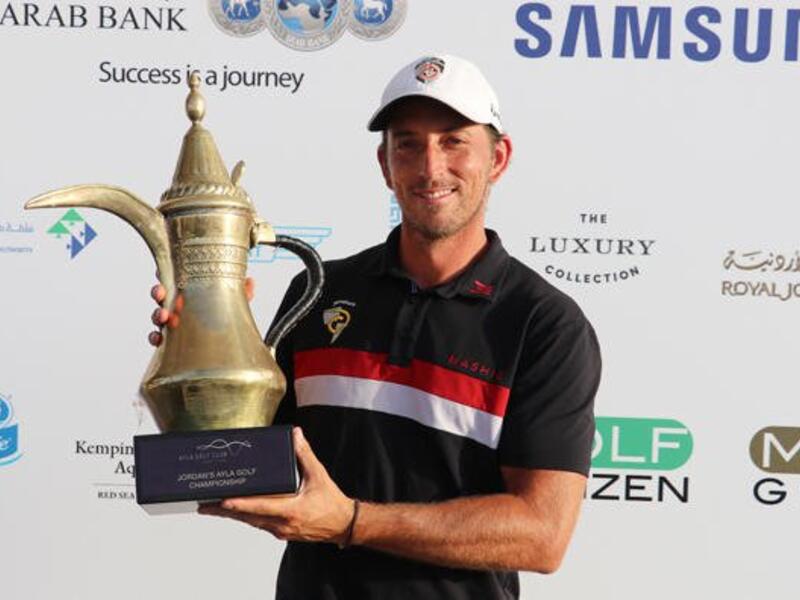Jamie Elson with the trophy after winning the Ayla Golf Championship on Saturday. (AN photo)