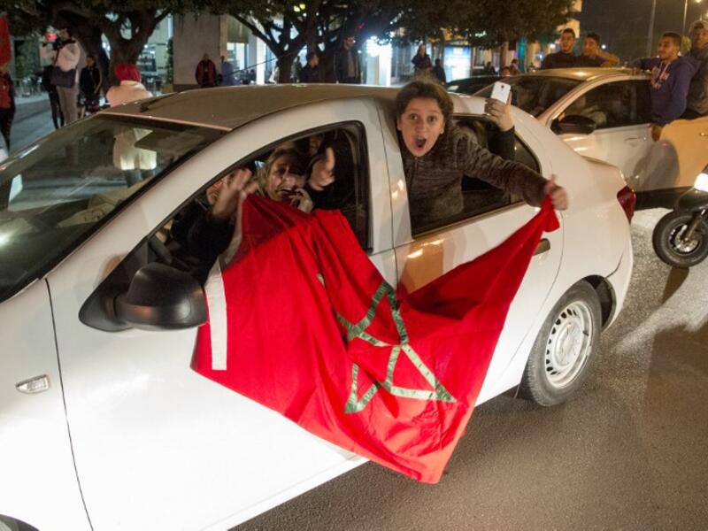 Moroccan supporters celebrate a victory after the end of the 2017 AFCON group C football match against the Ivory Coast in Rabat on January 24, 2017. The Ivory Coast were sent packing after losing 1-0. A brilliant Rachid Alioui goal gave Morocco the victory as the Atlas Lions marched on to the quarter-finals.
FADEL SENNA / AFP