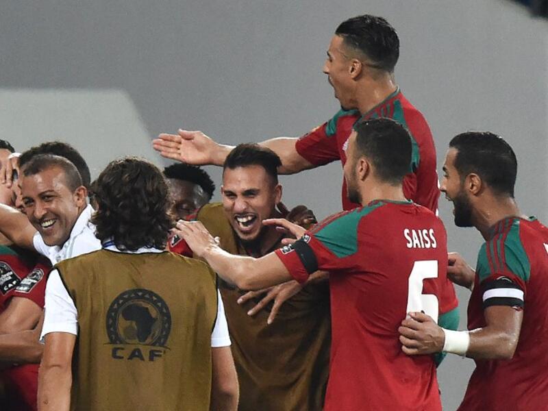 Morocco's players celebrate their third goal during the 2017 Africa Cup of Nations group C football match between Morocco and Togo in Oyem on January 20, 2017.
ISSOUF SANOGO / AFP