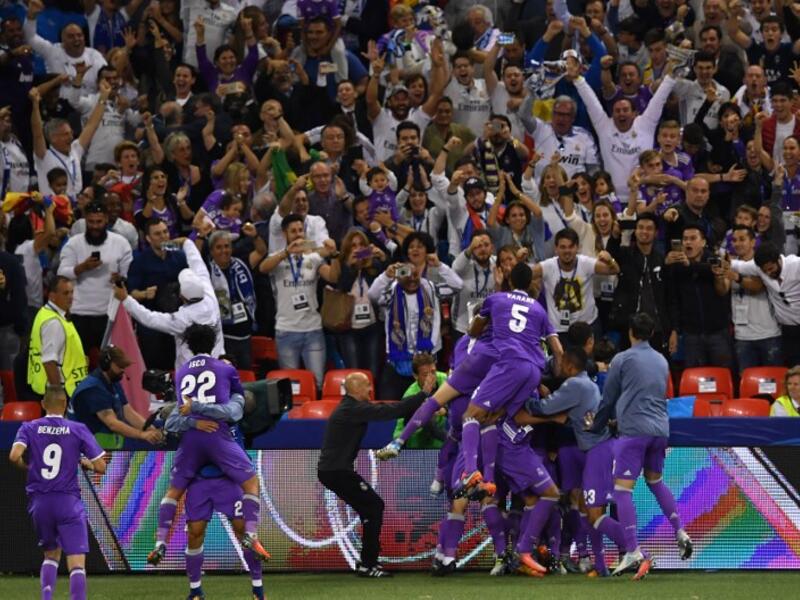 Real Madrid's players celebrate after scoring a goal during the UEFA Champions League final football match between Juventus and Real Madrid at The Principality Stadium in Cardiff, south Wales, on June 3, 2017.
Ben STANSALL / AFP
