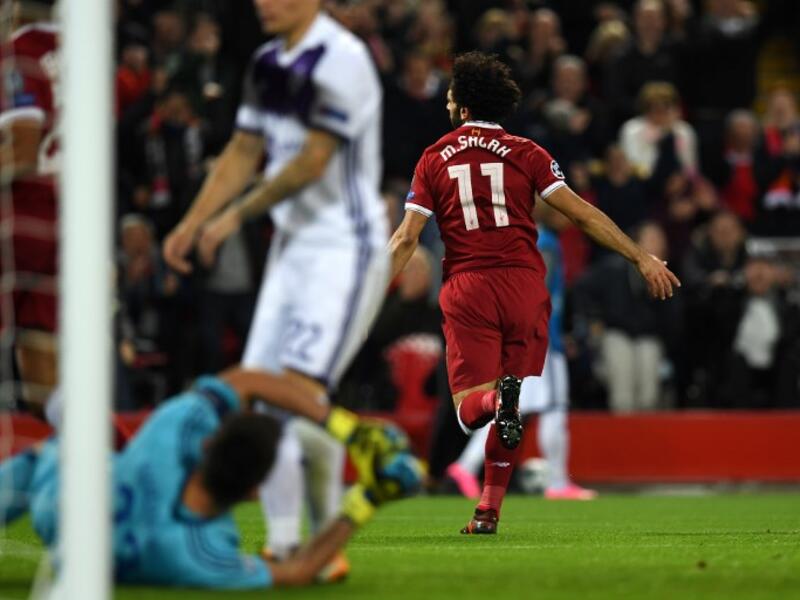 Liverpool's Egyptian midfielder Mohamed Salah (R) celebrates after scoring the opening goal of the UEFA Champions League Group E football match between Liverpool and NK Maribor at Anfield in Liverpool, north-west England on November 1, 2017.
Paul ELLIS / AFP