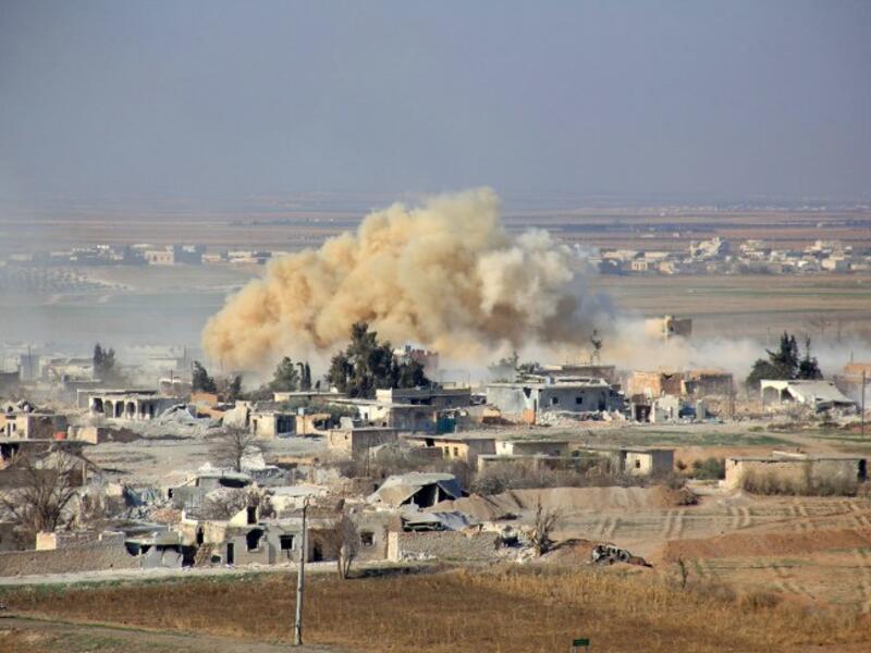 Smoke rises from an airstrike in Aleppo. (AFP/File)