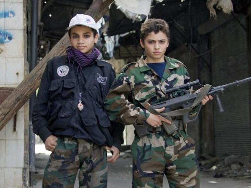 Free Syrian army's young fighters pose on April 2 (Guillaume Briquet/ AFP)