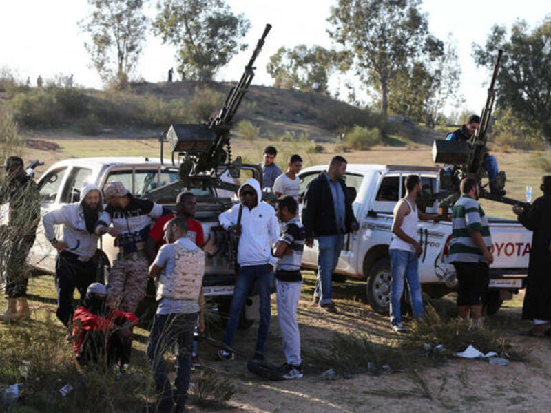 Members of the Tripoli Rebels Brigade militia patrol a main road in Tajura, 15 kms from the capital Tripoli. (Image credit: AFP)