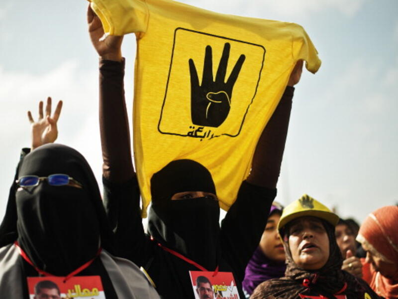A female supporter of the Muslim Brotherhood and of ousted president Mohamed Morsi during a rally outside the Police Academy where his trial is taking place on November 4, 2013, in Cairo. [GIANLUIGI GUERCIA/AFP/Getty Images]