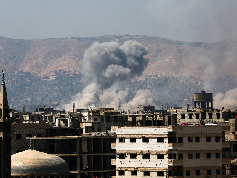 Regime warplane also dropped a barrel bomb on the town of Daraa in south Syria at 12.10am on Tuesday morning. (AFP) 