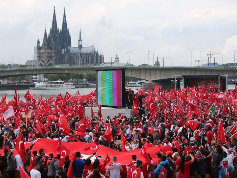Supporters of Turkish President Recep Tayyip Erdogan attend a rally on July 31, 2016 in Cologne, as tensions over Turkey's failed coup put authorities on edge. (AFP/Oliver Berg)
