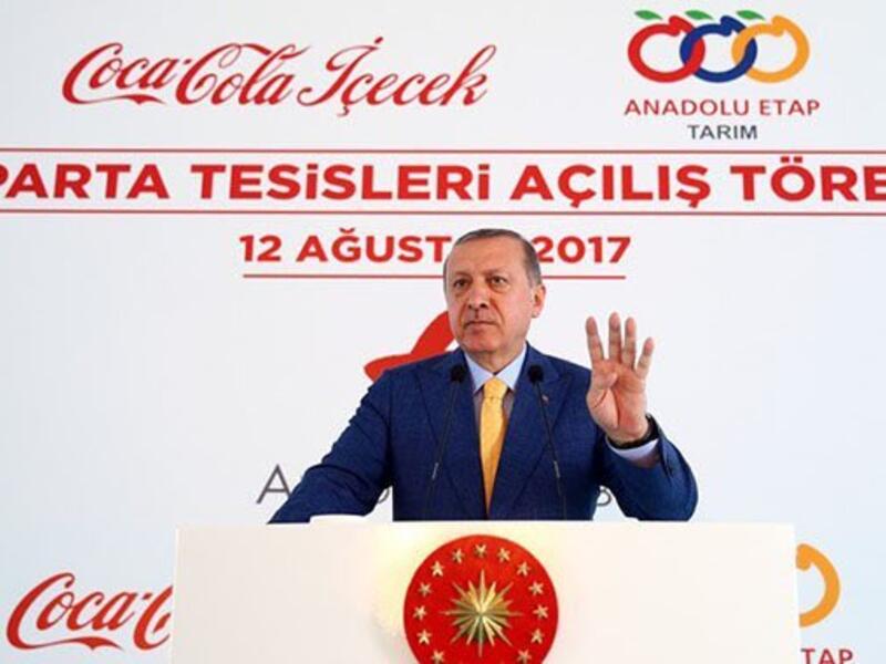 This image of Erdogan make the Rabaa sign while opening the Coca-Cola factory on Saturday was widely circulated on social media (Twitter)