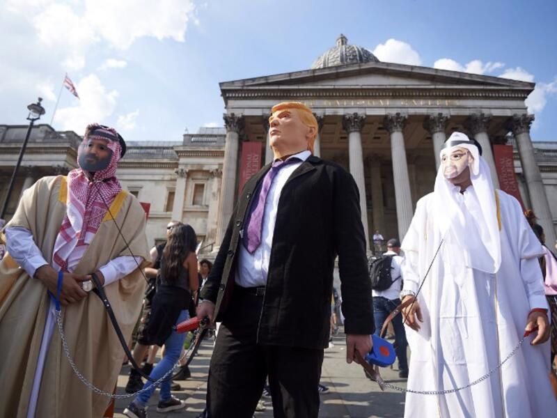 Protesters against the UK visit of US President Donald Trump gather in Trafalgar Square after taking part in a march in London on July 13, 2018.(Niklas HALLEN / AFP)