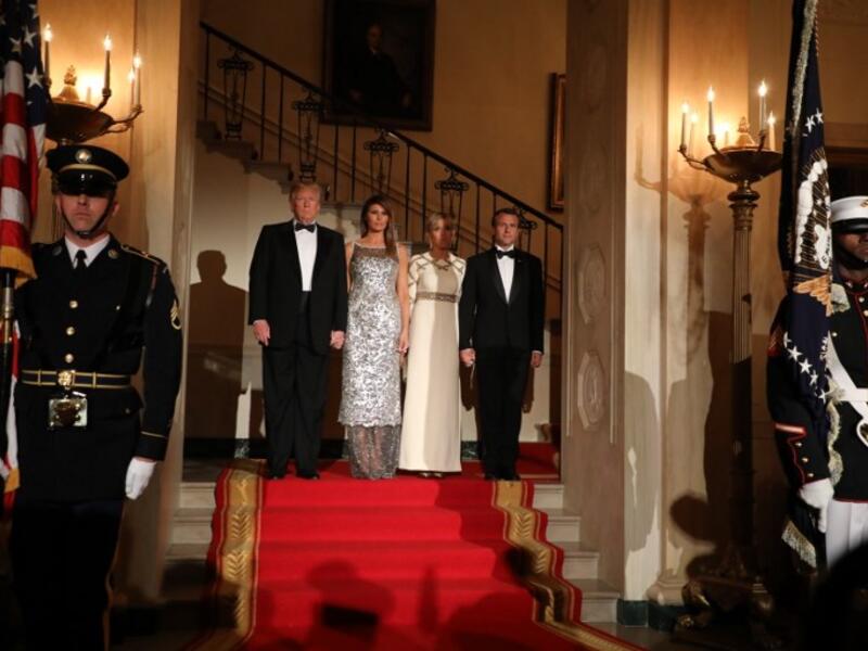 US President Donald Trump and First Lady Melania Trump stand with French President Emmanuel Macron and his wife, Brigitte Macron at the start of a State Dinner in the White House in Washington, DC, April 24, 2018. 
ludovic MARIN / AFP