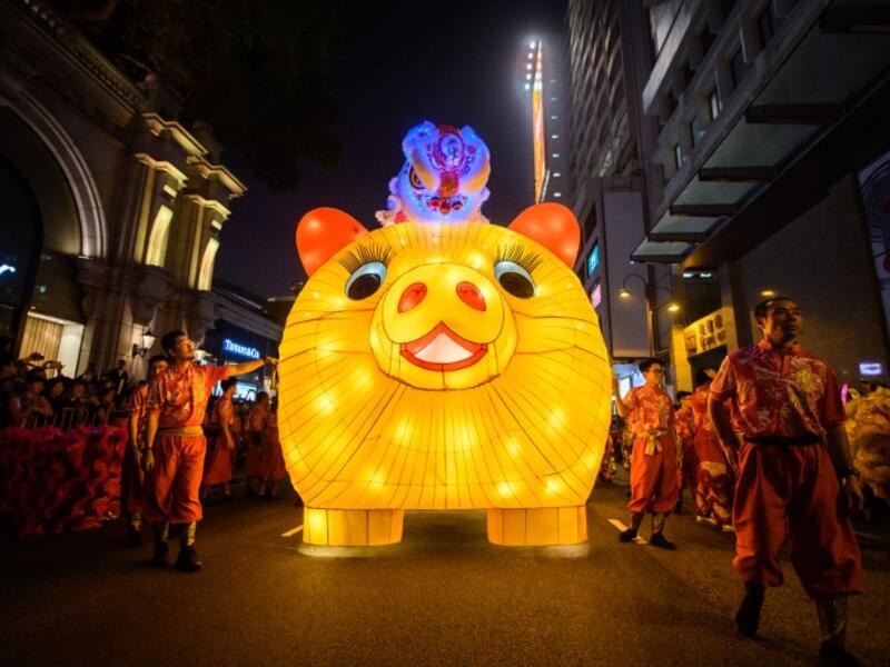 Performers walk with a lit model of a pig during the annual Lunar New Year parade in the Kowloon district of Hong Kong on February 5, 2019, to mark the Year of the Pig. 
Anthony WALLACE / AFP