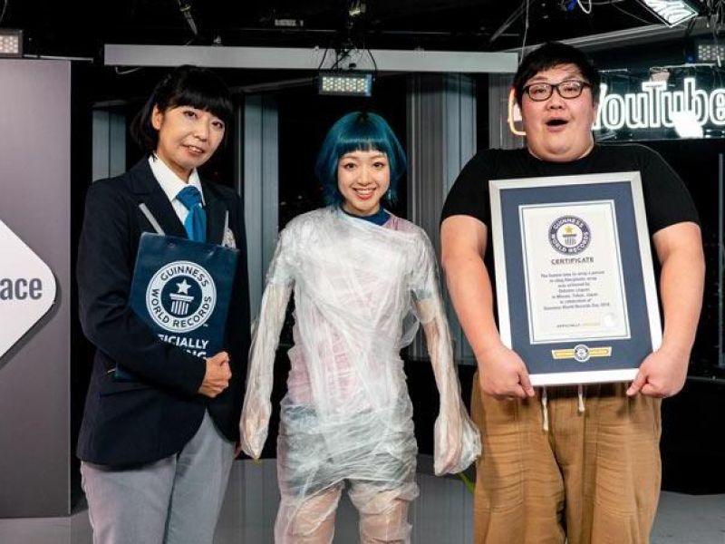 A Japanese YouTuber wrapped a singer from her feet to her shoulders in cling wrap to set a new world record. ( Guinness World Records)