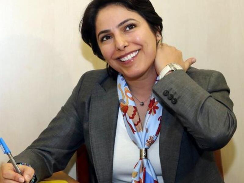 Kuwaiti candidate Reham al-Jlewe registers for the upcoming parliamentary election in Kuwait City (AFP)