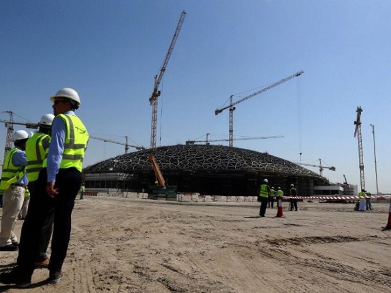 Abu Dhabi's effective policy response to low oil prices and economic growth were key drivers of Moody's outlook change. (AFP/ Marwan Naamani)
