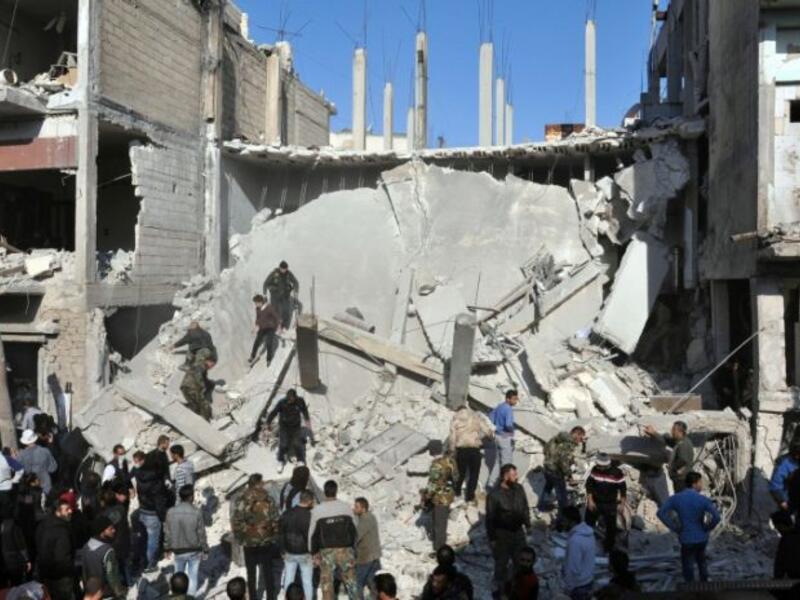 Aftermath of a suicide bombing in the Al-Zahraa neighborhood of Homs, Syria, December 28, 2015. (AFP/File)