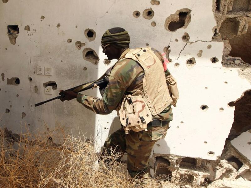A member of the Libyan pro-government forces patrols a rural area on the outskirts of the eastern coastal city of Benghazi which they retook from armed groups as fighting continues in the second city on April 19, 2016.  (AFP/Abdullah Doma)