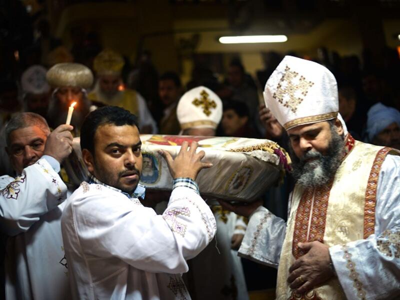 Egyptian Coptic Christian religious leaders celebrate Christmas in the monastery of Saint Samaan in Cairo on Jan. 6, 2015 (AFP)