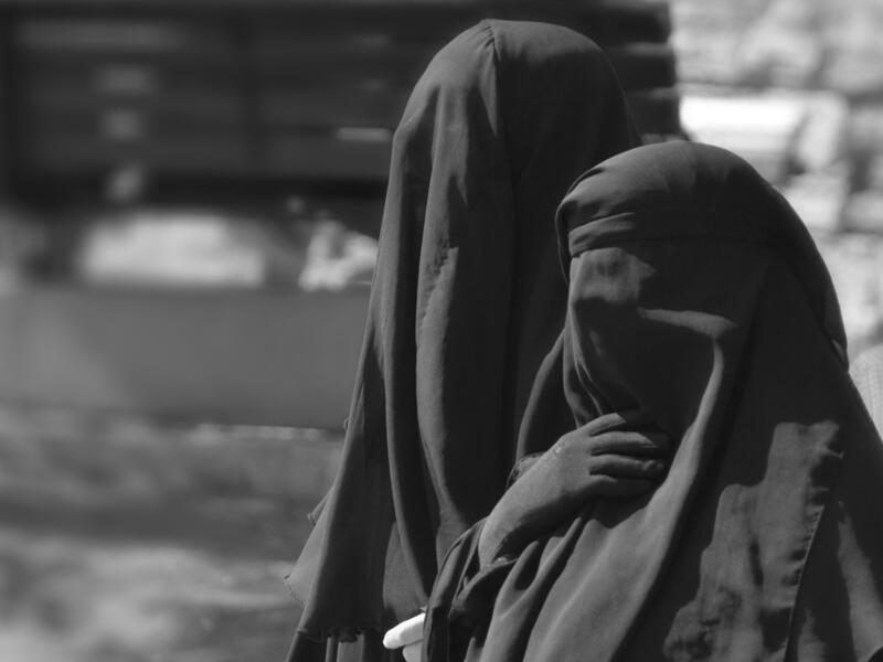 Daesh (ISIS) issued a fatwa banning women from appearing in public during fasting hours to avoid vice. The fatwa also bans women from appearing in public after fasting hours unless she is accompanied with one of her male family members. (Shutterstock)