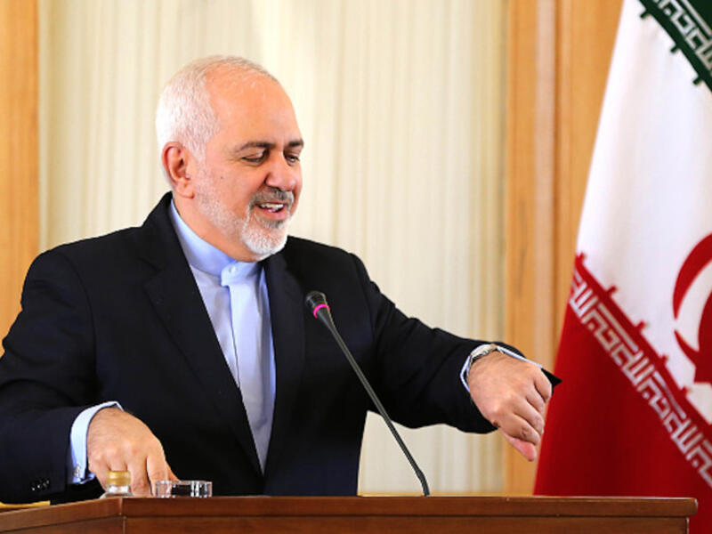 Iranian Foreign Minister Mohammad Javad Zarif checks his watch during a press conference in Tehran on Feb. 13. (AFP/ File Photo)