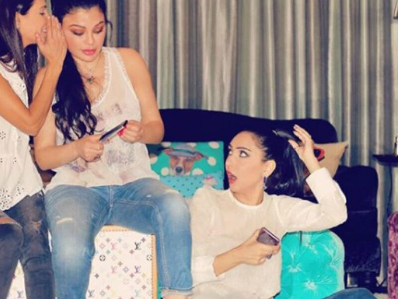 The Lebanese diva and her sisters sported casual looks with denim tight pants