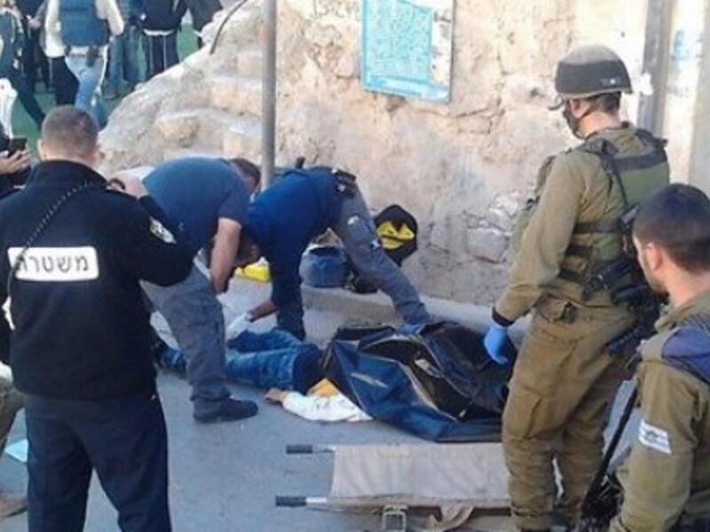 Israeli police are seen at a previous stabbing incident in Hebron. (AFP/File)