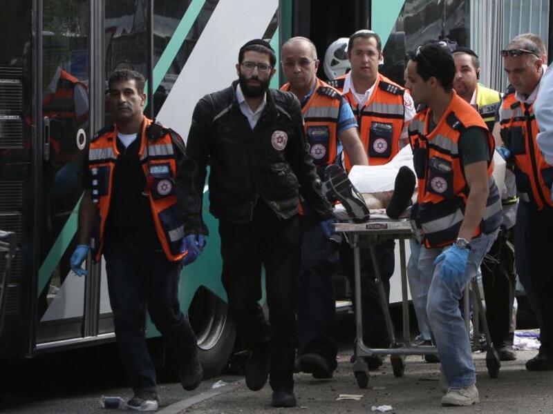 Israeli medics in Jerusalem after an alleged attack by Palestinians on a city bus in November 2015. (credit: AFP/Gali Tibbon) 